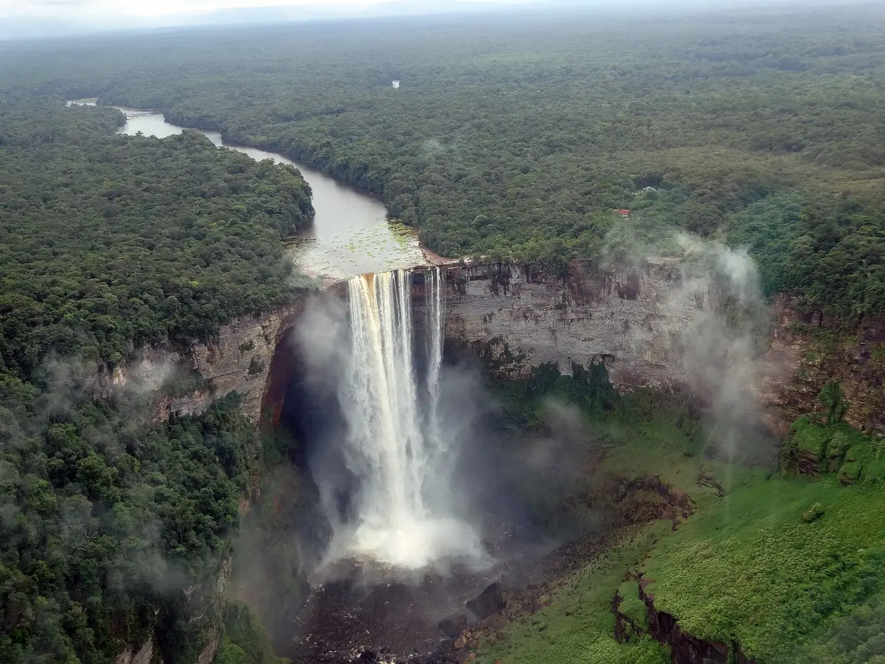 Kaieteur Falls seen from a light aircraft, the Potaro River pouring over a sandstone cliff into a forested gorge